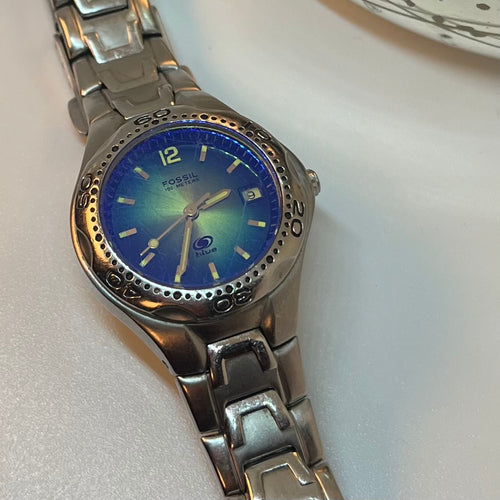 Fossil watch (MED) Women's watch- Blue Dive Three-Hand, Circular face, Blue crystal, Stainless Steel silver link band (Retail value $200)